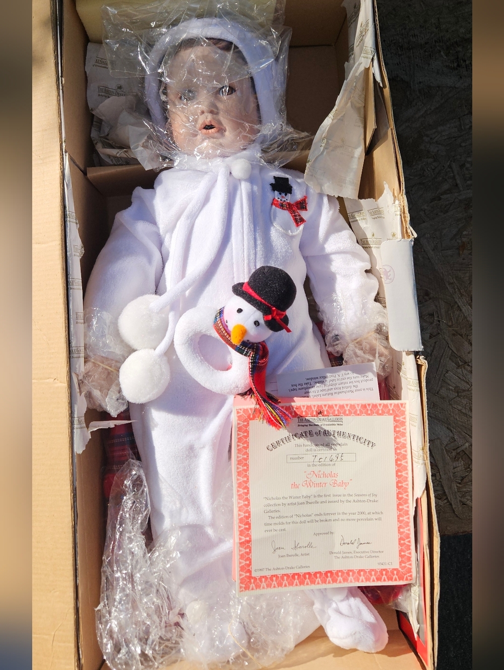 Porcelain Baby Doll in White Plush Snowman Outfit